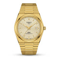 Tissot PRX gold tone watch with integrated bracelet and textured dial